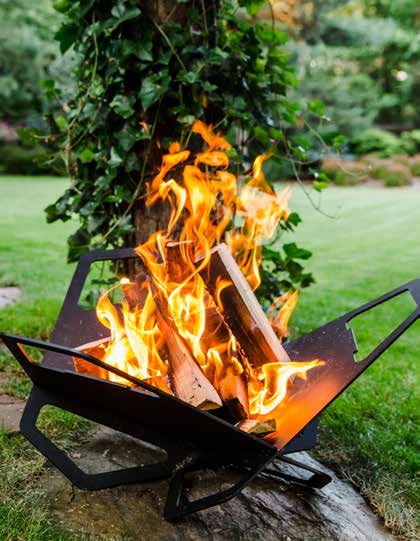 A raised geometric wood-burning fire pit in a garden.