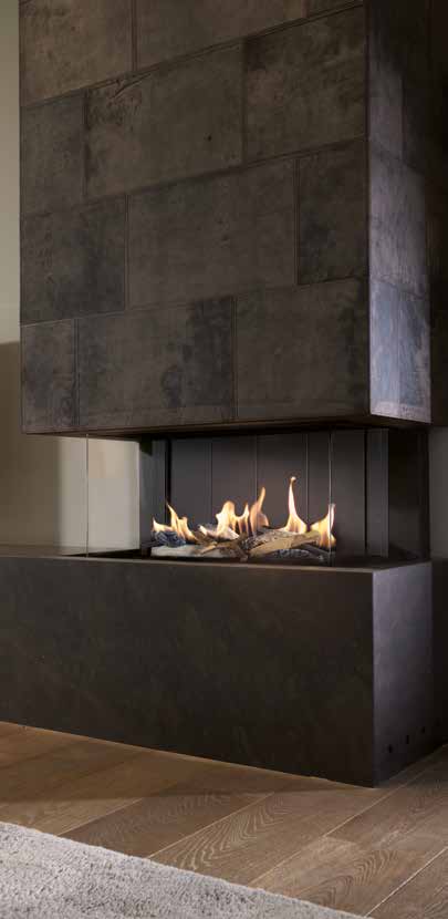 A glazed corner gas fireplace integrated into a tall stone chimney breast.