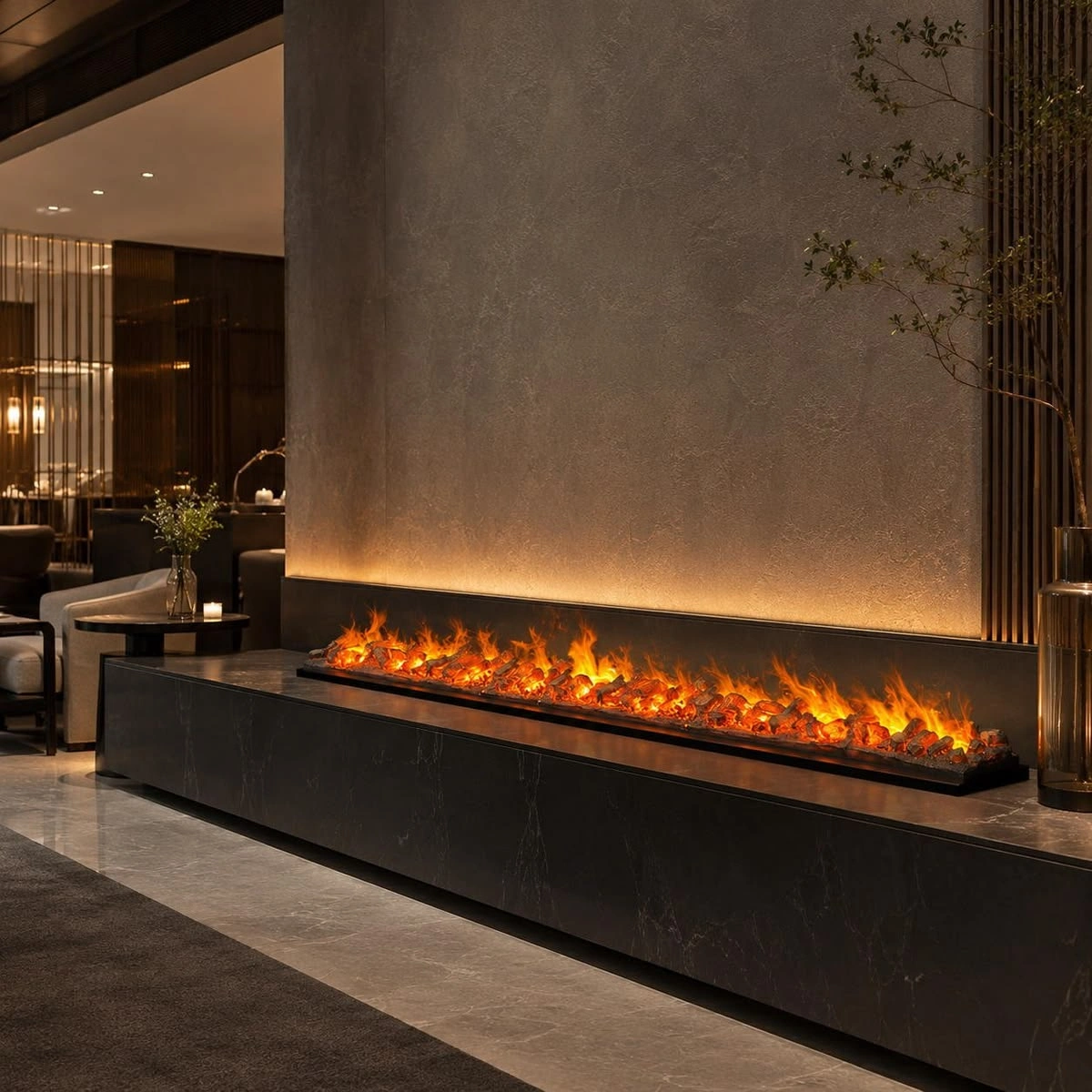 A wide electric fireplace fitted into a black marble feature wall.
